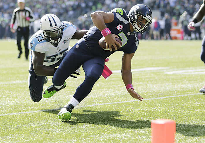 Russell Wilson has supplemented his lack of touchdowns with his rushing ability lately. (Scott Eklund/AP)